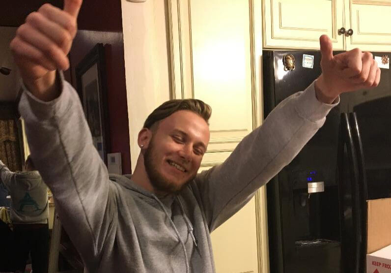 A photo of Patrick Michael Ramsey smiling with two thumbs up